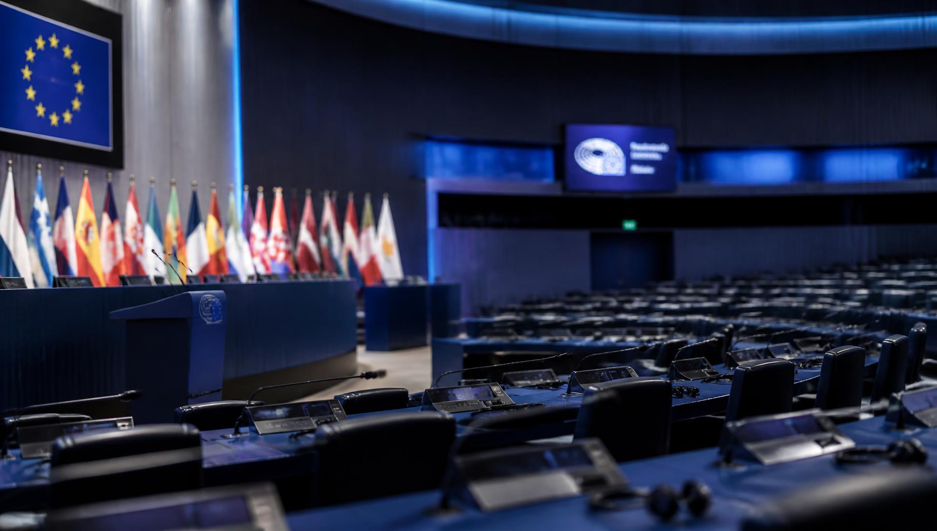 Empty European institutional assembly hall with member state flags